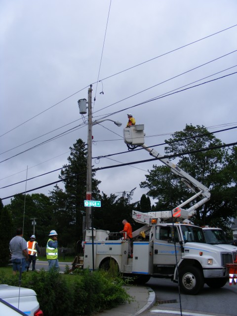 Electric company crews restoring power after large tree came down. Main St. at High St. 6/21/2009