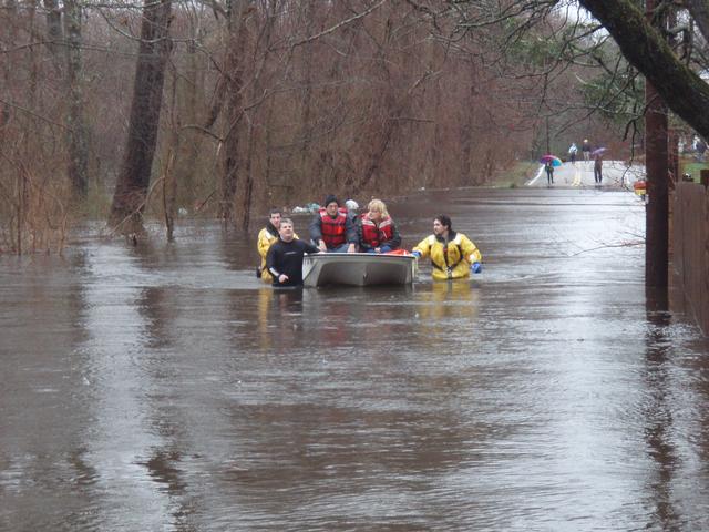 Members of Ashaway Fire and Westerly Rescue make rescues of people trapped in their homes on 3/30/10. picture is from Maxson Street looking north on Laurel Street.