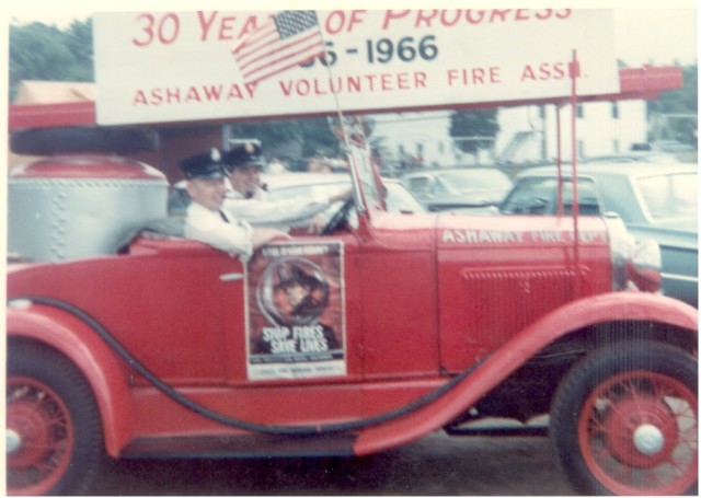 Parade in 1966. George Collins driving, Ira Thorpe passenger.